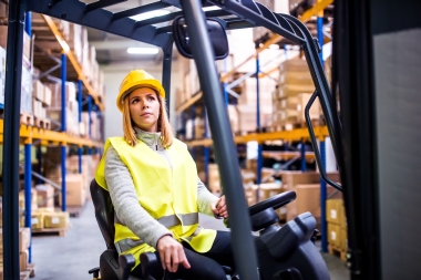 Woman driving a forklift truck