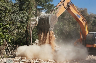 industrial digger moving rubble